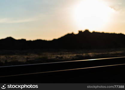 Horizontal vivid colourful railroad track sunset bokeh background backdrop. Horizontal vivid colourful railroad track sunset bokeh backgroun