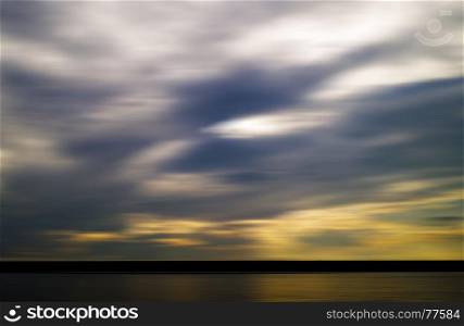 Horizontal vivid evening sunset on river motion blur abstraction background backdrop. Horizontal vivid evening sunset on river motion blur abstraction