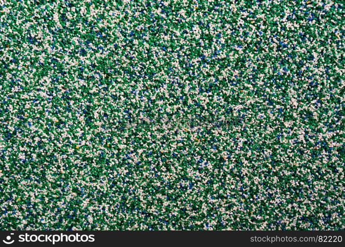 Horizontal vivid green blue pebble grainy sand textured abstract background backdrop. Horizontal vivid green blue pebble grainy sand textured abstract