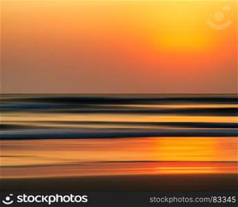Horizontal vivid orange golden Indian ocean sunset motion abstraction background backdrop. Horizontal vivid orange golden Indian ocean sunset motion abstra