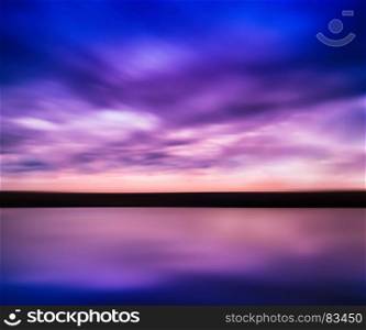 Horizontal vivid pink purple river sunset with reflection horizon landscape cloudscape background abstraction slow shutter. Horizontal vivid pink purple river sunset with reflection horizo