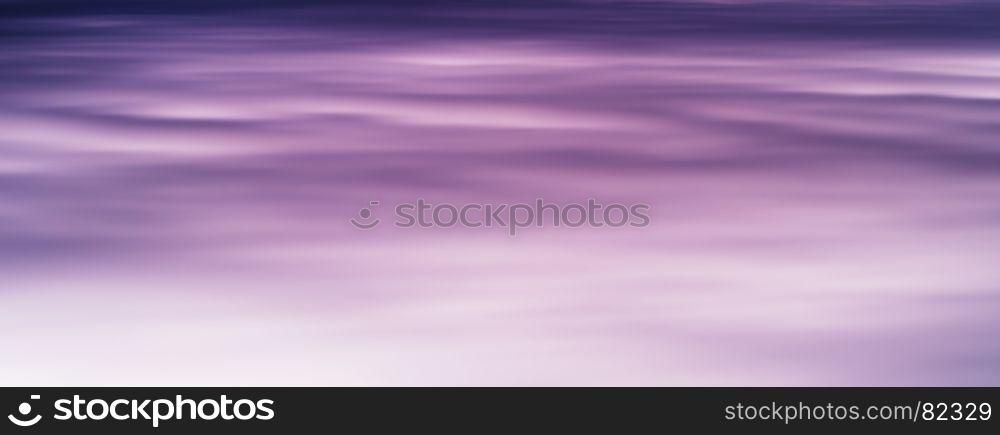 Horizontal vivid purple smooth sky fleecy clouds cloudscape background backdrop. Horizontal vivid purple smooth sky fleecy clouds cloudscape back