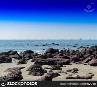 Horizontal vivid stony beach ocean horizon landscape background backdrop. Horizontal vivid stony beach ocean horizon landscape background