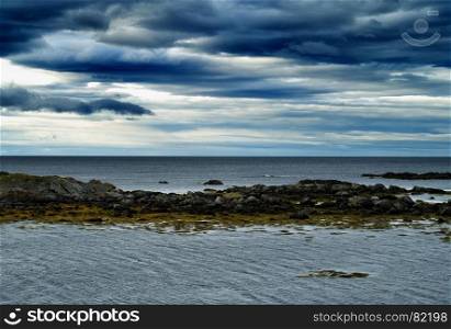 Horizontal vivid vibrant dramatic Norway beach ocean landscape background backdrop. Horizontal vivid vibrant dramatic Norway beach ocean landscape b