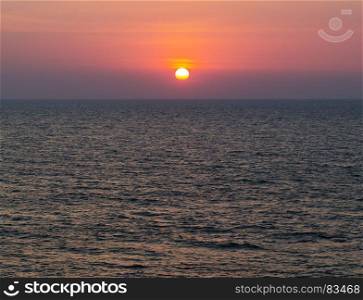 Horizontal vivid vibrant dramatic sunset in Indian ocean background backdrop. Horizontal vivid vibrant dramatic sunset in Indian ocean backgro