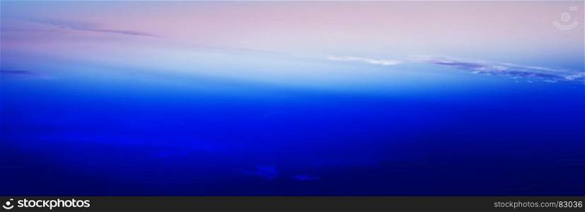 Horizontal wide blue vivid minimal clouds stratosphere background backdrop. Horizontal wide blue vivid minimal clouds stratosphere backgroun