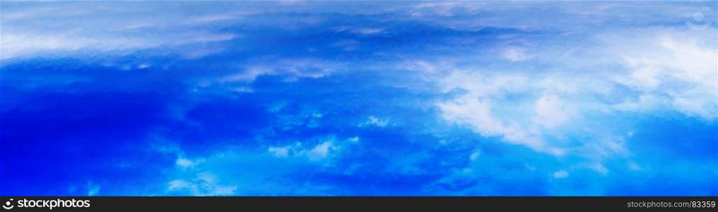 Horizontal wide panorama blue vivid above cloudscape background backdrop. Horizontal wide panorama blue vivid above cloudscape background