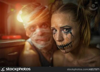 Horrible girl with her boyfriend, zombie halloween theme