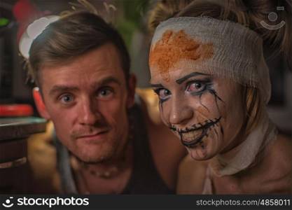 Horrible girl with her boyfriend, zombie halloween theme