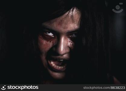 Horror bloodthirsty woman ghost or zombie she is horror scary with open mouth at dark night, Screaming zombie female face with blood, Happy halloween day festival concept