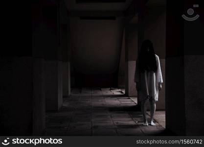 Horror woman ghost creepy standing at the house, halloween day concept