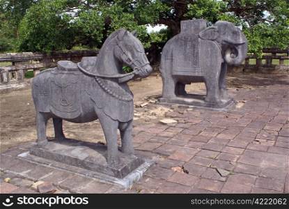 Horse and elephant on the ground of royal tomb near Hue in Vietnam