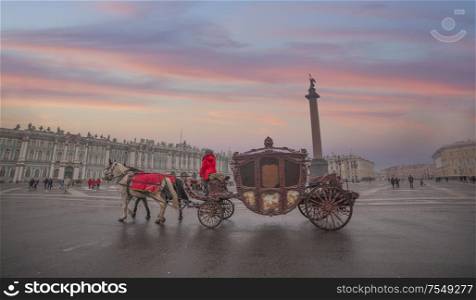 horse carriage on the background of the Winter Palace in St. Petersburg