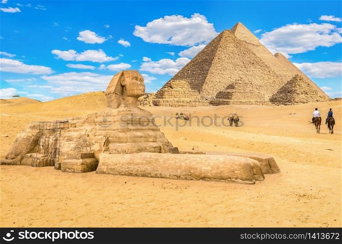 Horse riding among Pyramids and Sphinx in Giza, Cairo. Horse riding among Pyramids