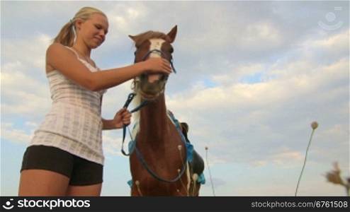 Horseback riding camp vacations girl rider with horse in field