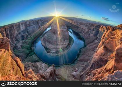 horseshoe bend at sunset with clear sky and colorado river below