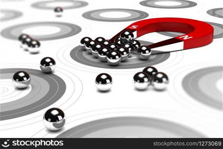 Horseshoe magnet attracting metal balls in the center of a grey target. Image concept of inbound marketing or advertising.. Inbound Marketing