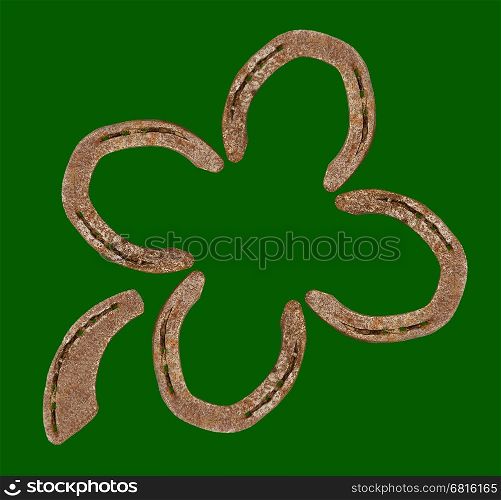 Horseshoes forming a clover leaf as a symbol for good luck