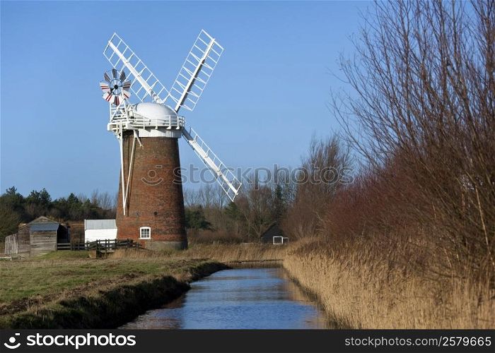 Horsey Windpump on the Horsey Marshes in Norfolk, England. The pump was used to drain the surrounding marsh land as this whole area is prone to flooding.