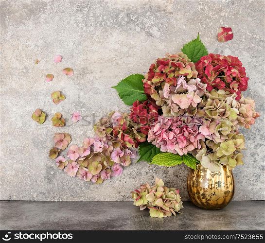 Hortensia flowers bouquet over grungy stone background