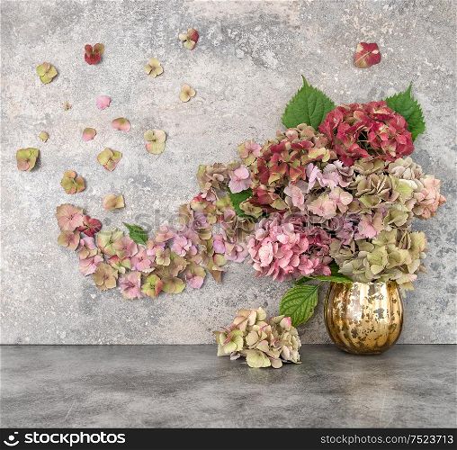 Hortensia flowers bouquet over grungy stone background. Floral arrangement