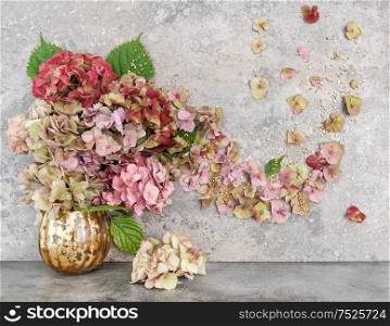 Hortensia flowers bouquet with golden decoration. Autumn floral composition