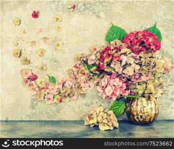 Hortensia flowers bouquet with golden decoration. Vintage style toned picture