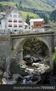 HOSPENTAL, SWITZERLAND - CIRCA AUGUST 2015Old arch stone bridge