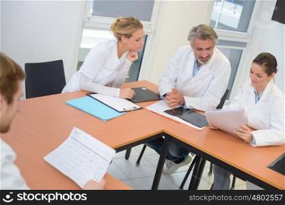 hospital coworkers checking documents