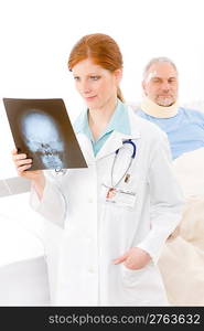 Hospital - female doctor examine x-ray senior patient