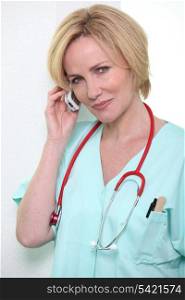 Hospital medic using a cellphone