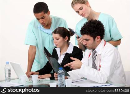 hospital staff analyzing a case