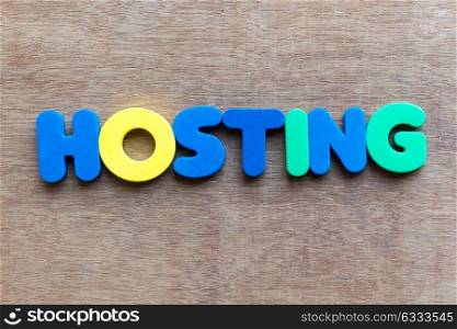 hosting colorful word in the wooden background