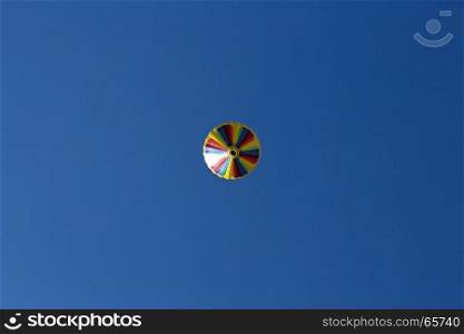 Hot air balloon, photographed against the blue cloudless sky