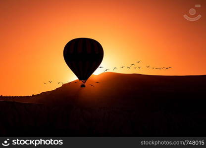 Hot air balloons floating high up in the sky in Goreme Cappadocia - Turkey Balloon Fest 2019