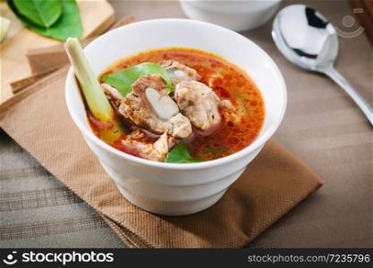 Hot and spicy soup with pork ribs,shallow Depth of Field,Focus on pork ribs. . Hot and spicy soup with pork ribs.
