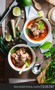 Hot and spicy soup with pork ribs,shallow Depth of Field,Focus on pork ribs. . Hot and spicy soup with pork ribs.