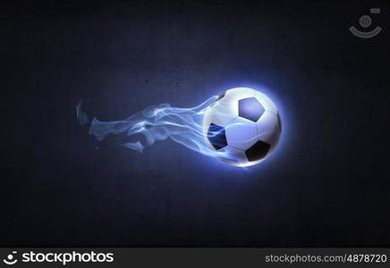 Hot ball. Conceptual image of football ball in fire flames