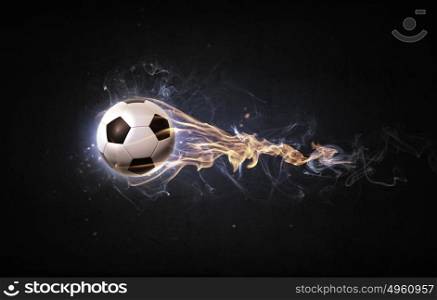 Hot ball. Conceptual image of football ball in fire flames