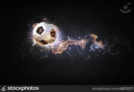 Hot ball. Conceptual image of football ball in fire flames