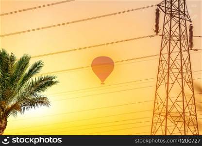 Hot balloon in he yellow sky of Egypt at sunrise. Hot balloon in Egypt