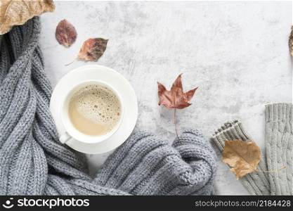 hot beverage with warm sweater light surface