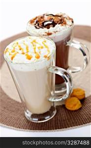 Hot beverages of coffee and chocolate with whipped cream