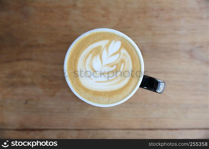 hot cappuccino coffee on wood background
