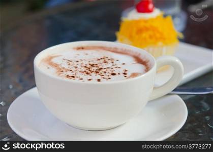 hot cappuccino in white coffee cup
