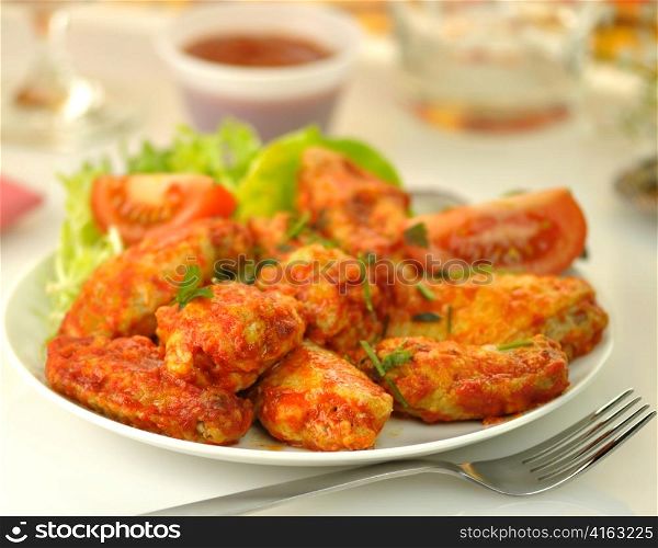 hot chicken wings with salad