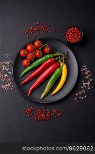 Hot chili peppers of three different colors red, green and yellow as an ingredient for making hot sauce