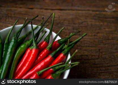 hot chili peppers on a wooden board