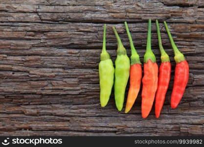 Hot chili peppers on old wooden