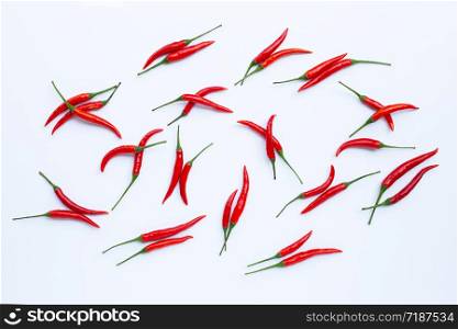 Hot chili peppers on white background. Top view